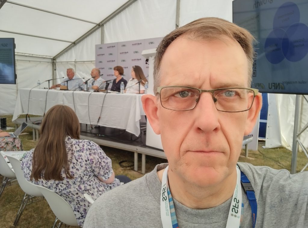 Green Councillor Stephen Thompson at a farming conference in East Malling, Kent. A panel is taking place.
